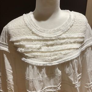 Boutique white blouse with fancy trim.